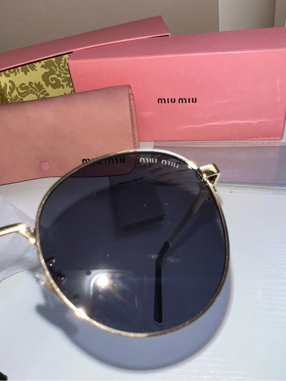 Miu Miu Gold Metal Round Sunglasses with Black Lenses